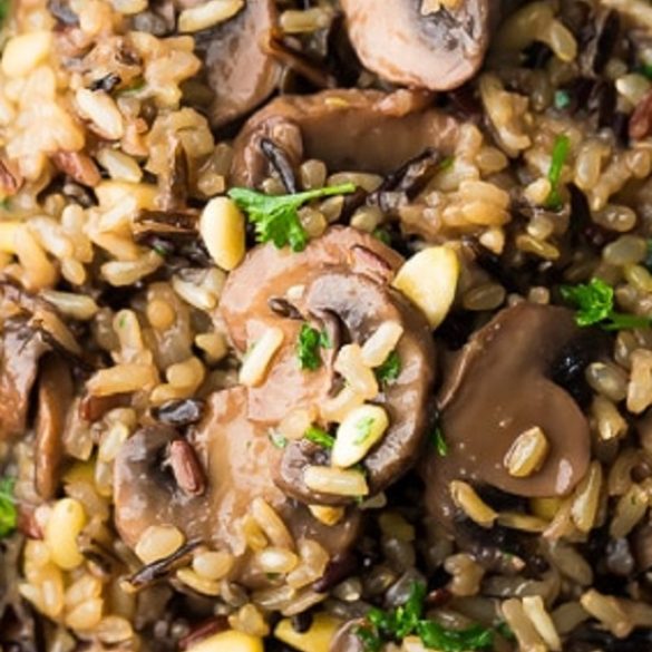 Pressure cooker wild rice pilaf with mushrooms and pine nuts. Wild rice with mushrooms, vegetables, and dry white wine cooked in an electric instant pot and served with pine nuts. #pressurecooker #instantpot #vegetarian #vegan #healthy #lowcarb #diet