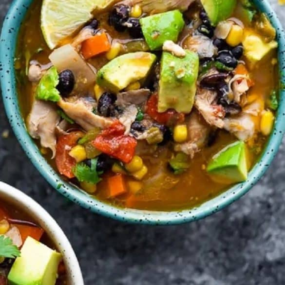 Slow cooker Mexican chicken stew recipe. Chicken thighs with vegetables, beans, and spices cooked in a slow cooker. #slowcooker #crockpot #chicken #stew #mexican #dinner #homemade