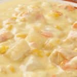 Slow cooker creamy chicken potato chowder. Creamy chowder with diced chicken, potatoes, and corn cooked in a slow cooker. Very easy and delicious! #slowcooker #crockpot #chicken #dinner #chowder