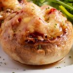 Air fryer mushrooms stuffed with cheese and ham recipe. Learn how to cook cheese and ham stuffed mushrooms in an air fryer. #airfryer #dinner #appetizers #easy