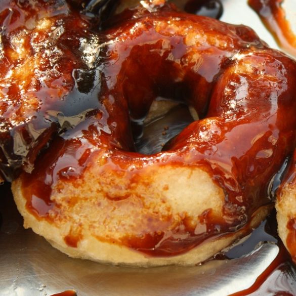 Air fryer donuts with chocolate sauce. These donuts are light and fluffy on the inside, crisp on the outside, and covered in rich chocolate sauce. #airfryer #donuts #desserts #breakfast #recipes #food #cooking