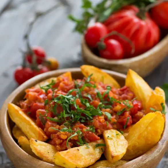air-fryer-spanish-spicy-potatoes-recipe Air fryer Spanish spicy potatoes recipe. These spacy potatoes are ideal for the next time you want to cook Spanish cuisine. They're not only versatile but super easy to make. #airfryer #vegetarian #vegan #potatoes #dinner #healthy