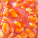 Slow cooker white beans with tomato sauce. This is a hearty and healthy dish that is perfect for those cold winter months. The beans are filling and delicious, and the tomato sauce adds a nice sweetness to them. #slowcooker #crockpot #healthy #dinner #vegetarian #vegan