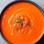 Slow cooker sweet red pepper soup recipe. This soup is a hearty, comforting meal that only takes a few hours to make. It's packed with fire-roasted sweet red peppers, fresh tomato juice, and spices. #slowcooker #crockpot #soups #vegetarian #vegan #healthy #dinner