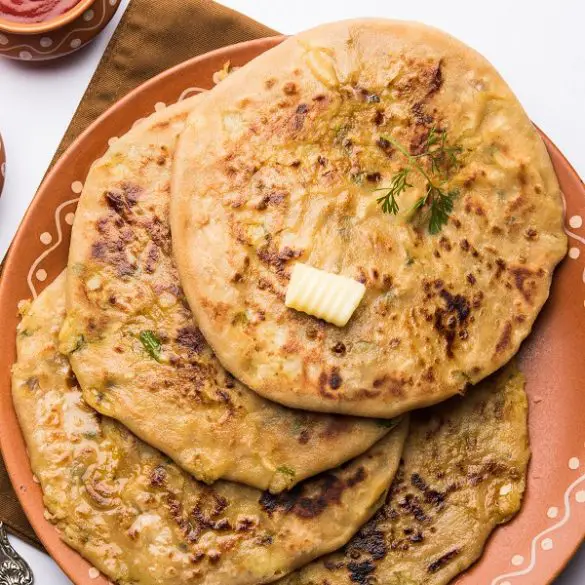 Air fryer potato paratha recipe. Potato paratha is a common breakfast option for people from Bangladesh, India, and Pakistan. #airfryer #breakfast #homemade #indian #vegetarian #vegan #healthy