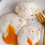 Slow cooker poached eggs recipe. This poached eggs recipe is perfect for a delicious, protein-packed breakfast! It's cooked overnight in the slow cooker and results in a tender, tasty egg. #slowcooker #crockpot #recipes 3poachedeggs #homemade #easy #healthy #delicious